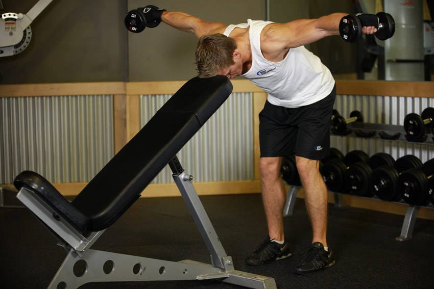 Bent Over Dumbbell Rear Delt Raise With Head On Bench - Step 1