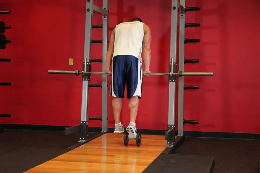 Calf Raise On A Dumbbell - Step 1