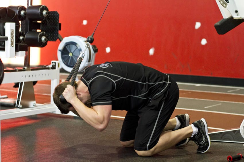 Kneeling Cable Crunch With Alternating Oblique Twists - Step 1