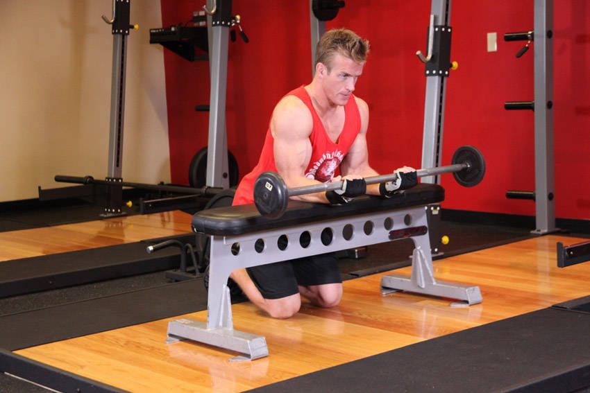 Palms-Up Barbell Wrist Curl Over A Bench - Step 1