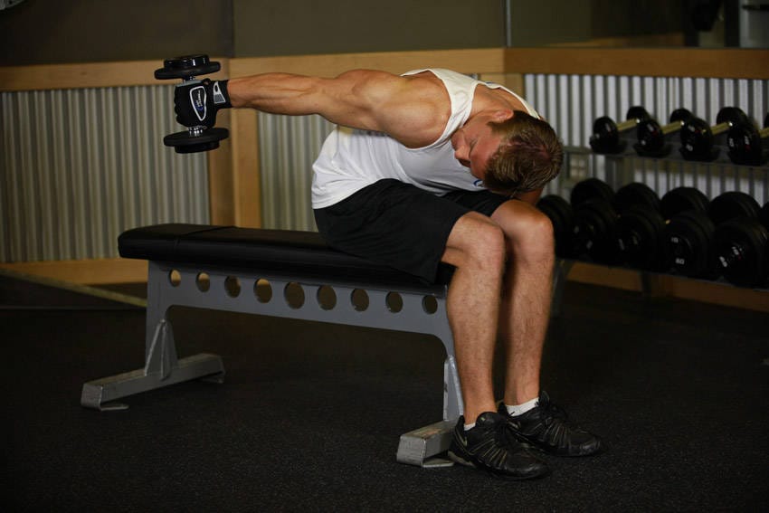 Seated Bent-Over One-Arm Dumbbell Triceps Extension - Step 1