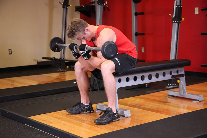 Seated Close-Grip Concentration Barbell Curl - Step 1