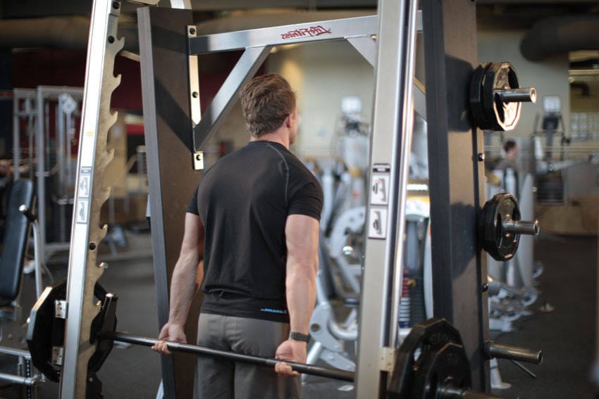 Smith Machine Behind the Back Shrug - Step 0