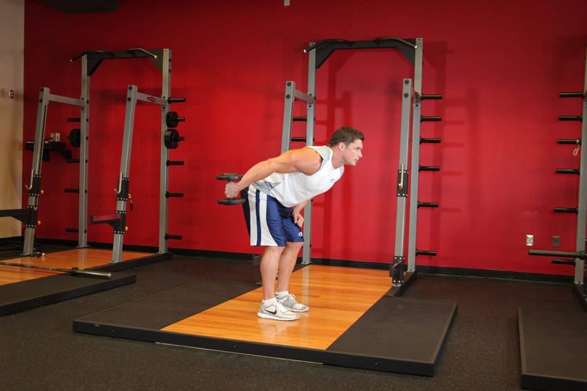 Standing Bent-Over One-Arm Dumbbell Triceps Extension - Step 1