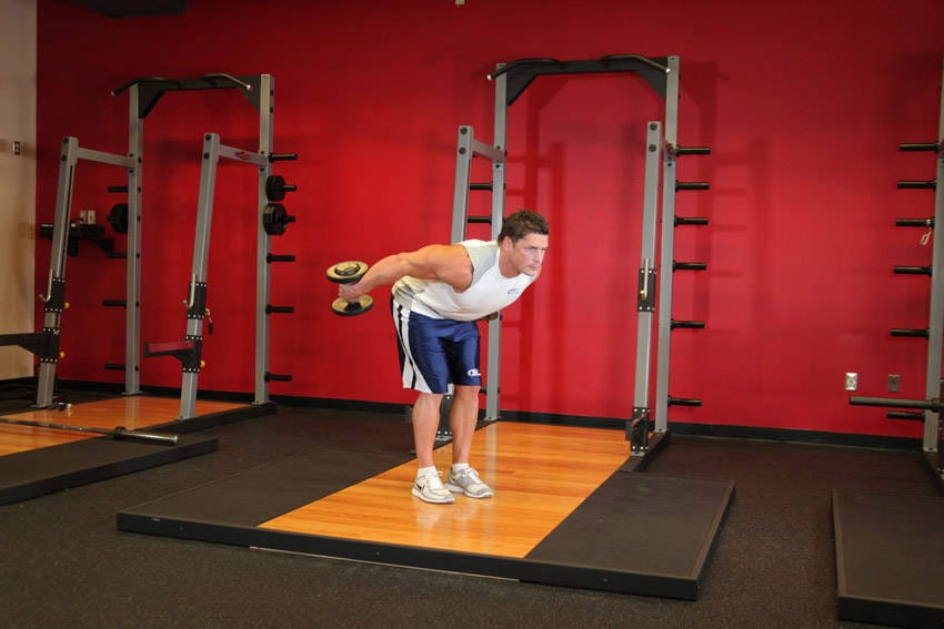Standing Bent-Over Two-Arm Dumbbell Triceps Extension - Step 1