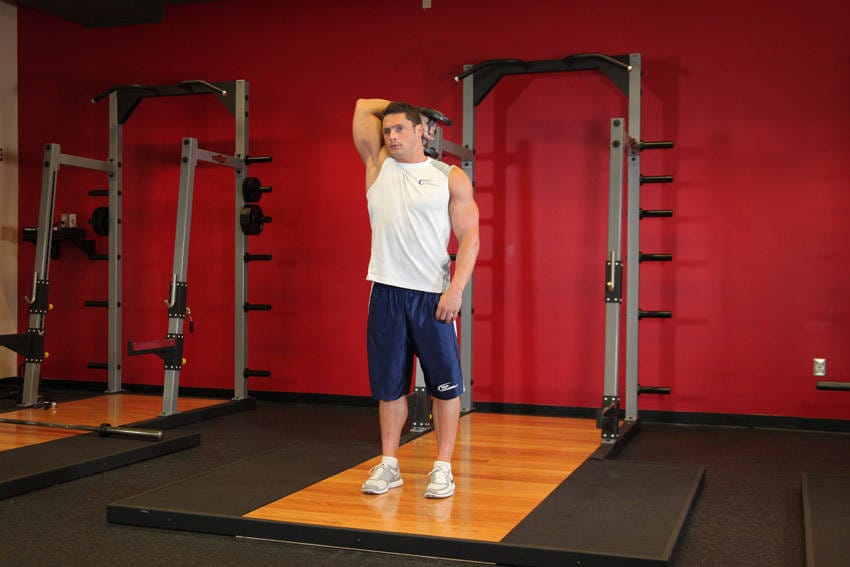 Standing One-Arm Dumbbell Triceps Extension - Step 1