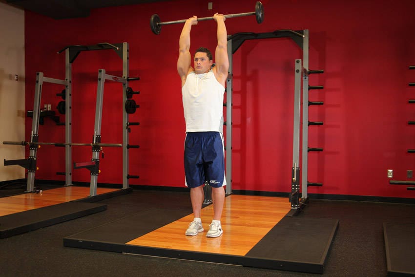 Standing Overhead Barbell Triceps Extension - Step 1